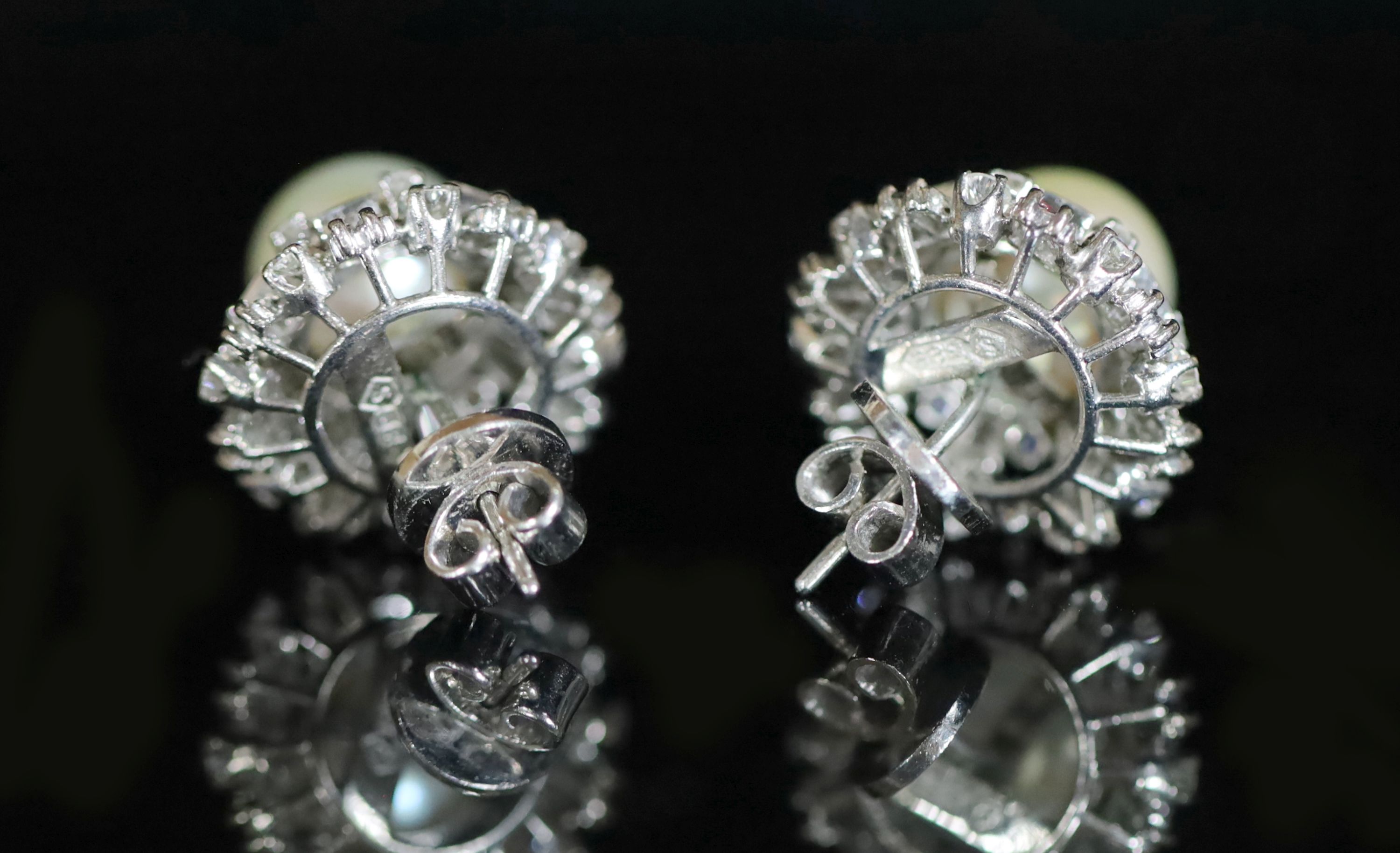 A pair of 14ct gold (585) cultured pearl and diamond set circular cluster stud earrings,